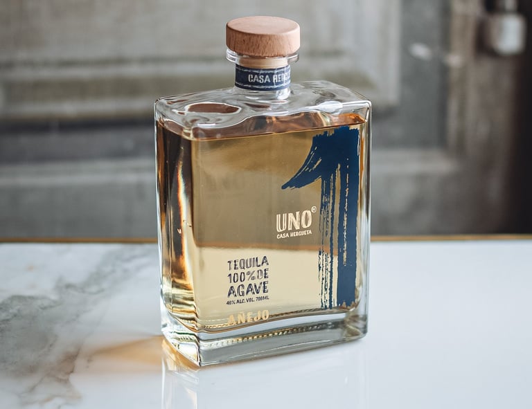 a bottle of Tequila Uno Añejo - premium tequila añejo