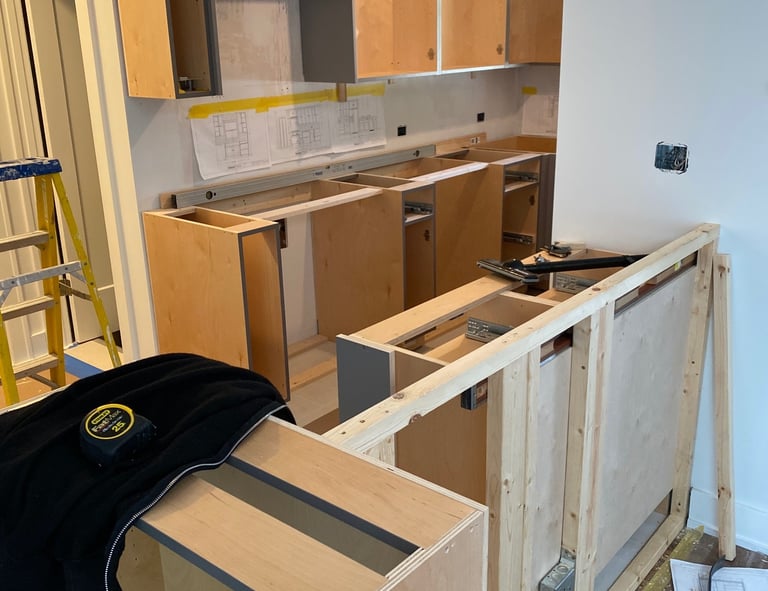 During a kitchen remodeling with blueprints and tools.