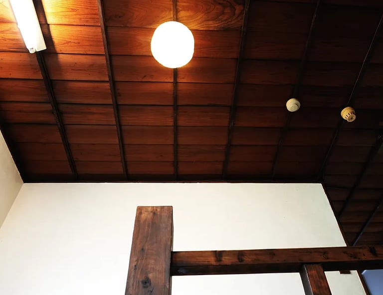 A historic wooden staircase showcasing traditional Japanese architecture at Nakadaya.