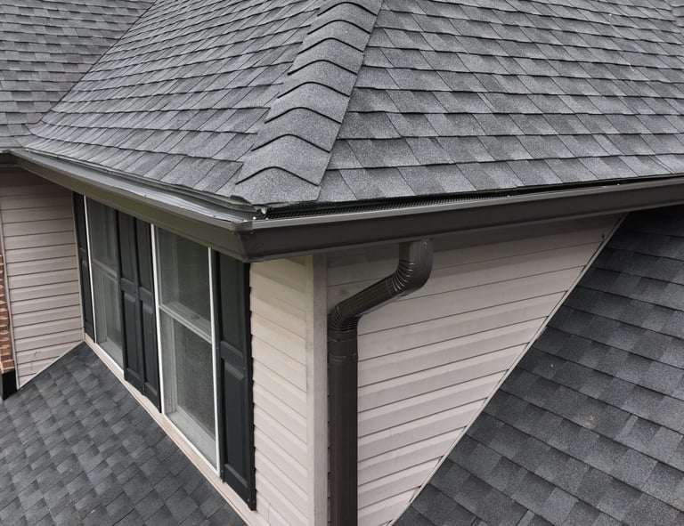 Seamless gutter installation and asphalt shingle roof on residential home in New Jersey