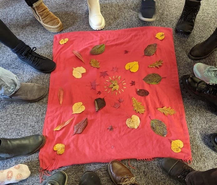 feet around mandala of leaves