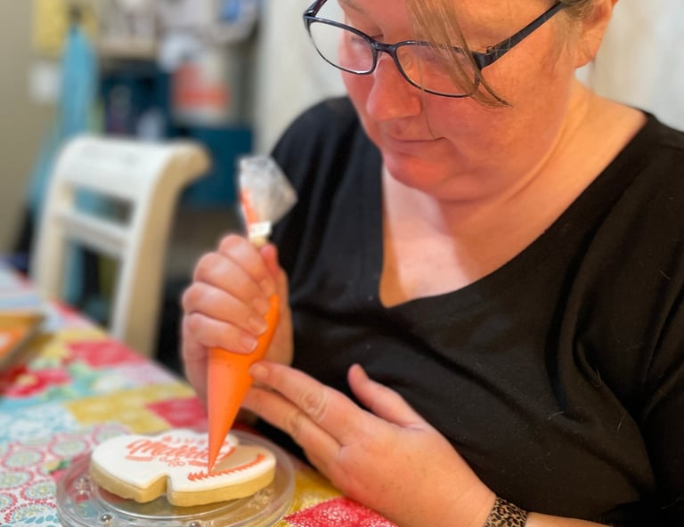 women decorating cookies