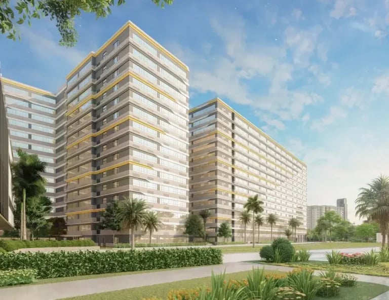 a large building with a lot of trees and bushes