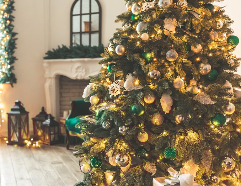 a christmas tree with presents in a room