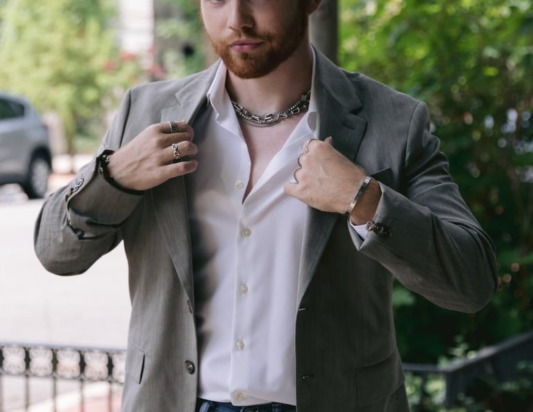a man in a suit jacket and a white shirt