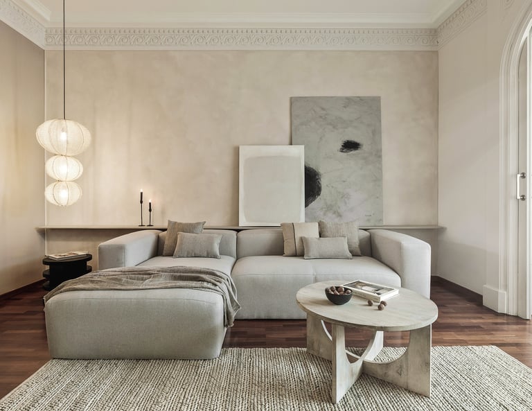 Sophisticated Living room with modern decor, custom lighting, a neutral color palette and art