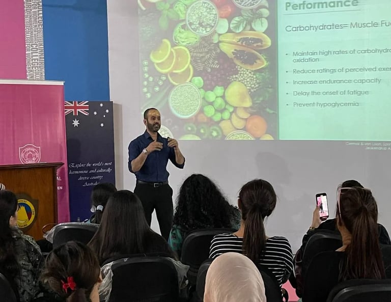 SESI founder delivers a nutrition seminar on carbohydrates and performance to college students..