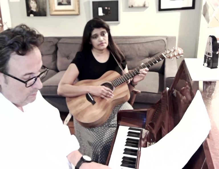 Wayland Stephens teaching songwriting to a student., songwriter houston, songwriting tutor