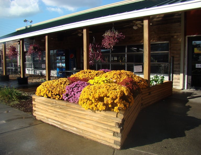 outdoor flower box in front of large porch