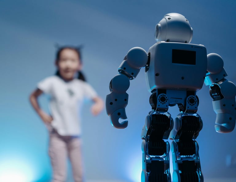 Child playing with a robot. Alpha Beta Workshops in Pakistan. alpha-beta.net