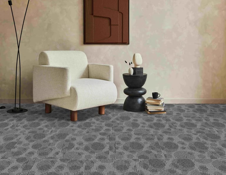 Living room with grey carpet tiles in an organic bubble pattern - ideal for offices