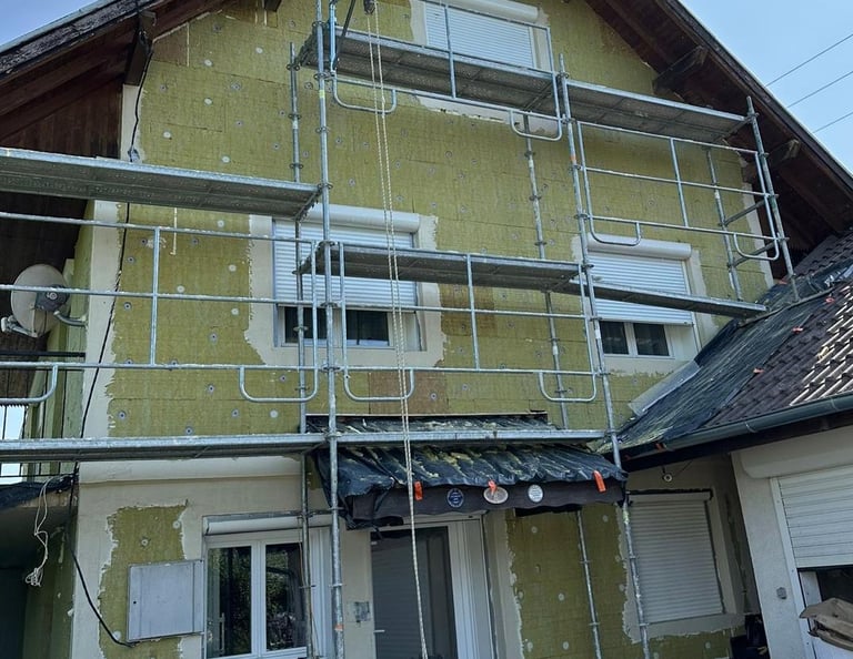 a house with a scafaffe on a scaffolded up to