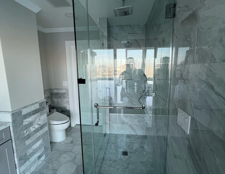 Completed bathroom remodel with waterproofing and tile work by Asha Construction