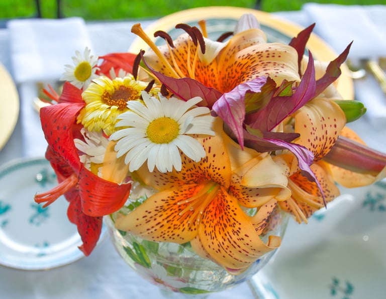 a vase with flowers on a table as wedding decoration
