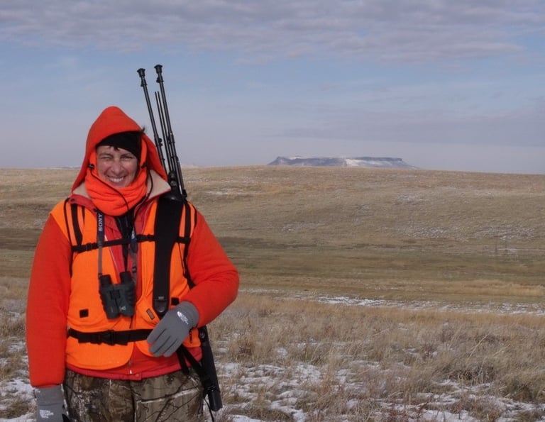 Miss Pauline enjoying winter hunting in Cascade Montana with Square Butte as a backdrop