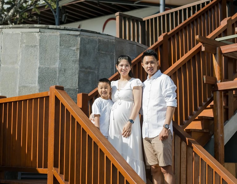 Family walking down the staircase during a relaxed family photography session at Anantara Uluwatu Bali.