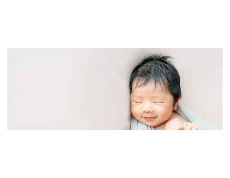 Gorgeous baby sleeping with a smile