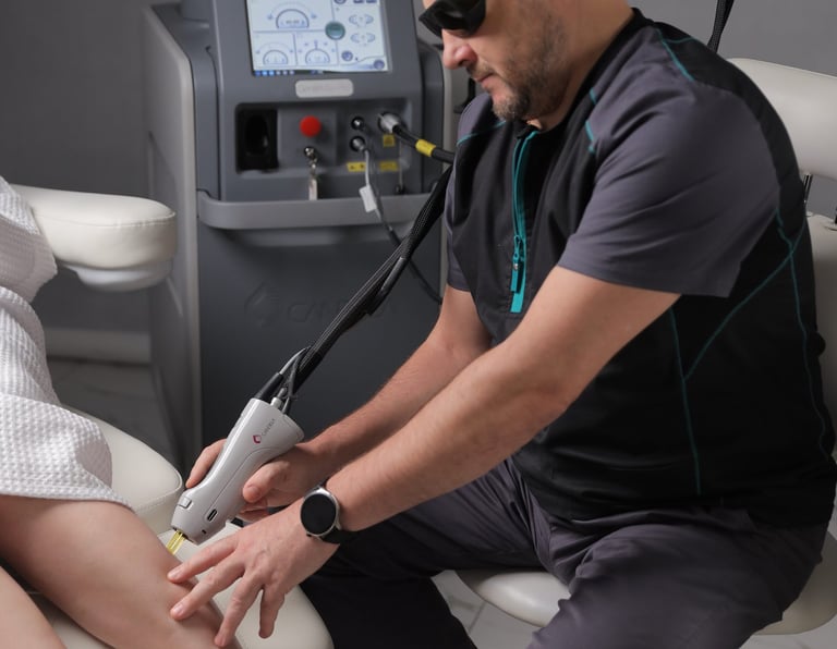 a man in a white robe is getting a foot massage