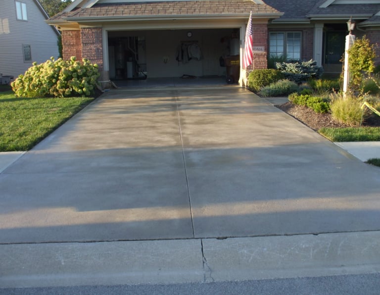 a driveway with a driveway and driveway with a flag