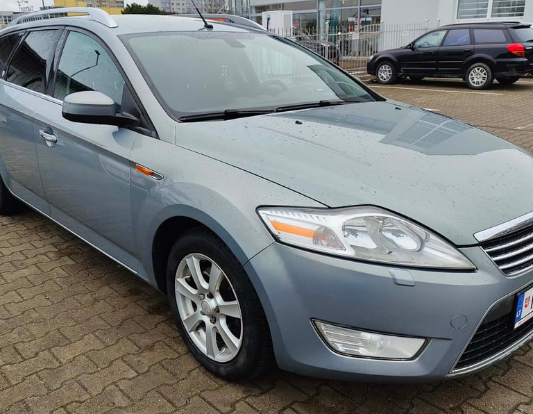 a car parked in a parking lot with a car parked in front of it