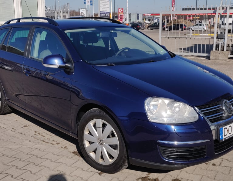 a blue volkswagen golf wagon