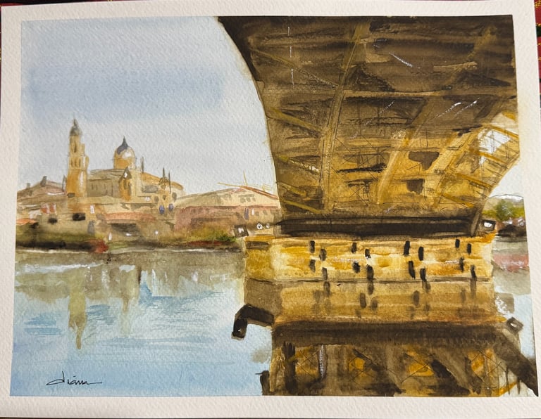 a painting of the Salamanca University seeing from the bridge