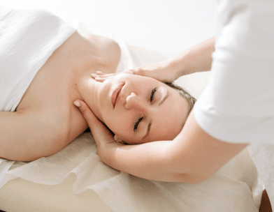 a woman is getting a massage at a spa