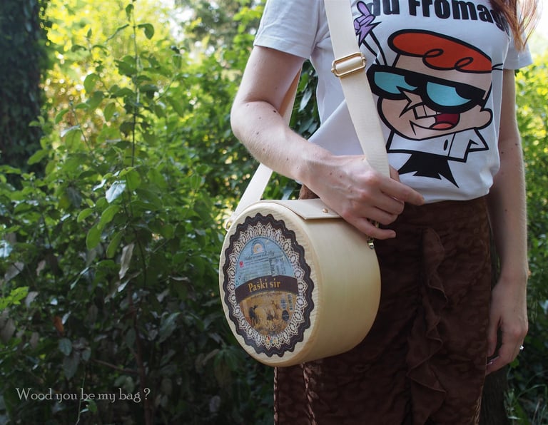  round wooden bag shaped like the big cheese