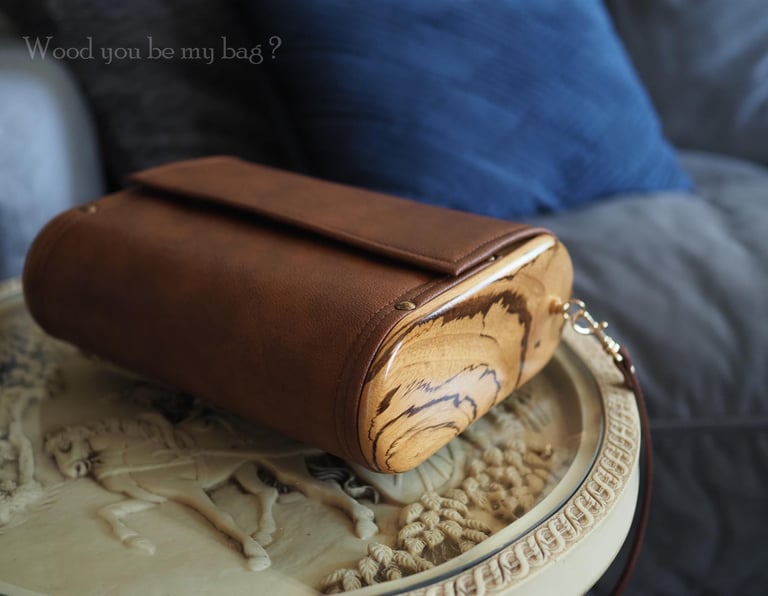 Wooden bag made from zebrano wood and brown faux leather