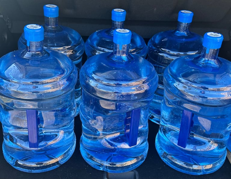 Six 18.9L spring water jugs for Aquifer Springs refills.