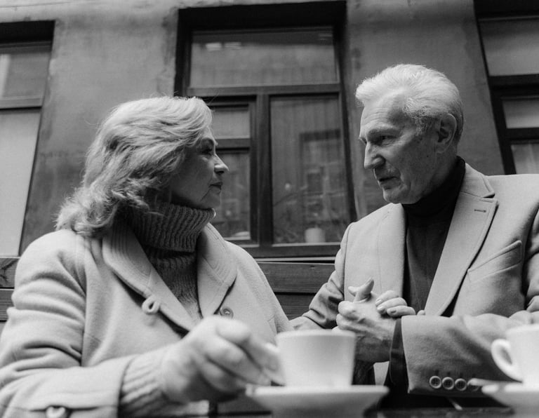 a man and woman sitting at a coffee shop having met on piano piano