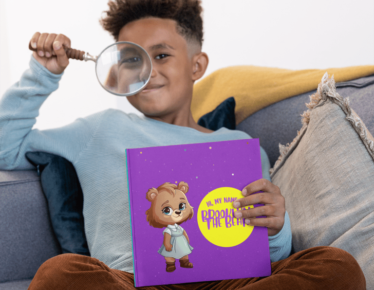 young boy with a book learning how to read