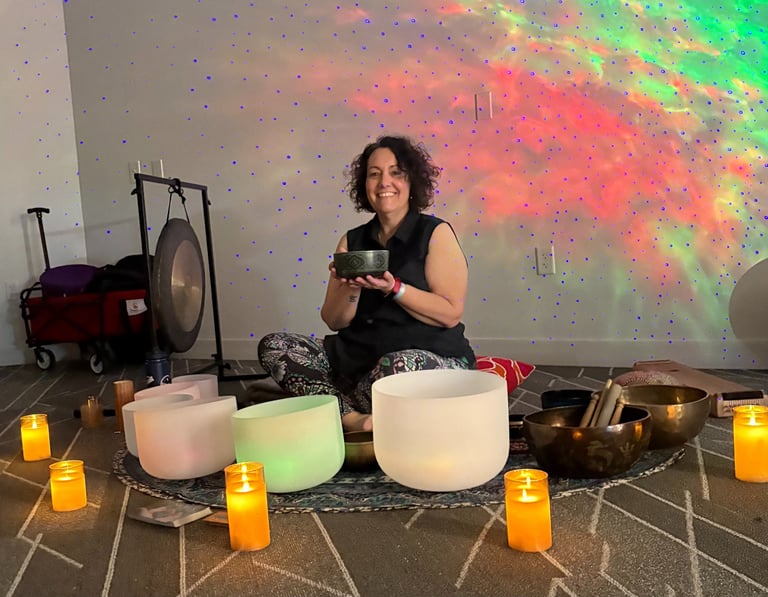 Kelly surrounded by her singing bowls 