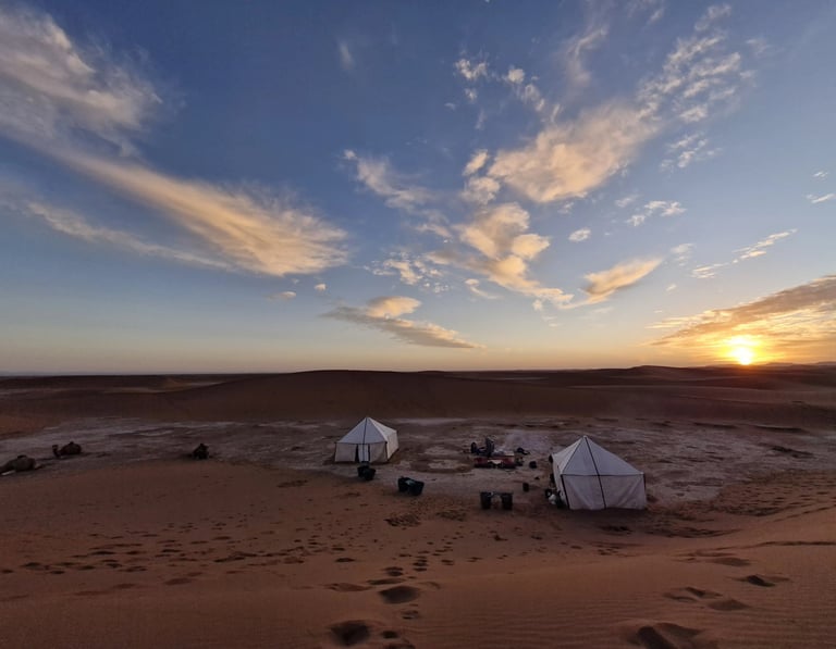 View over a camp in the Moroccan Sahara desert at sunset