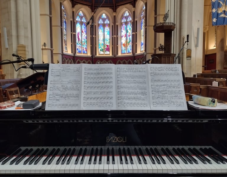 Photo of a grand piano in a chapel