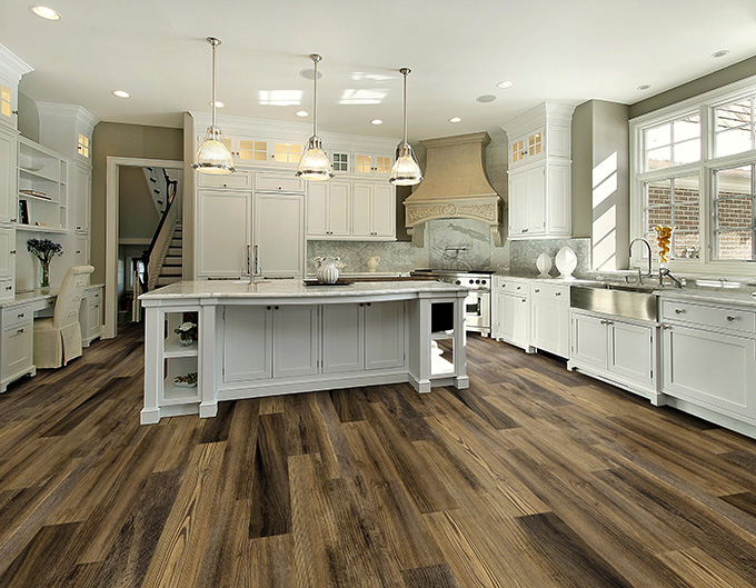 Comparing different flooring samples when choosing kitchen or bathroom flooring.