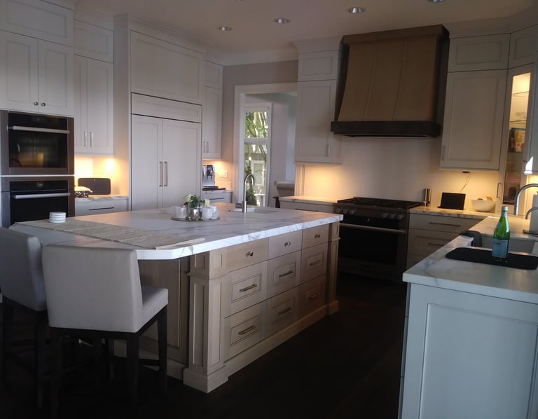 solid Caesarstone island countertop with white oak cabinets