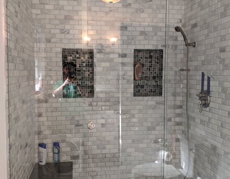 glass shower barn doors with subway tile