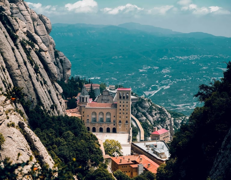 Panoramic view of the Montserrat Monastery perched on rugged mountain cliffs