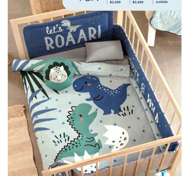 Cunero azul con estampado de dinosaurio modelo Rex de la marca Vianney