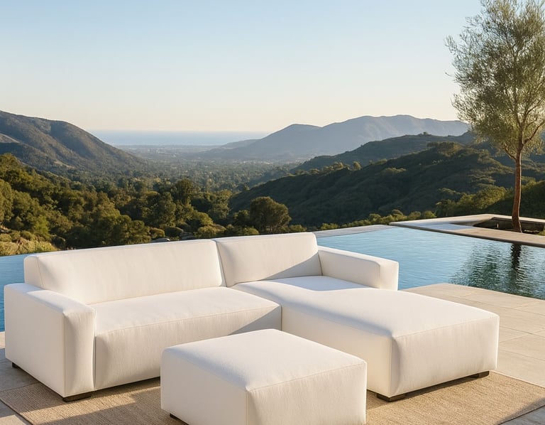 Modern white sectional sofa by Solo Home Decor in a luxurious mountain backyard with an infinity pool and ocean view.