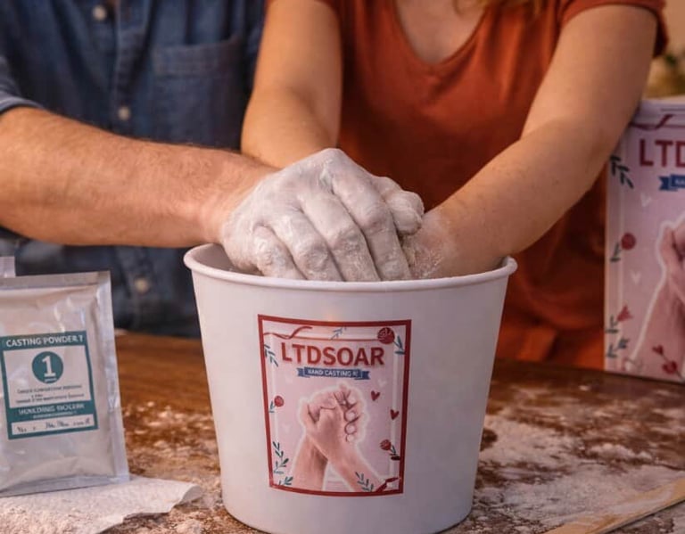 Couple creating a keepsake hand casting together using a DIY molding kit at home