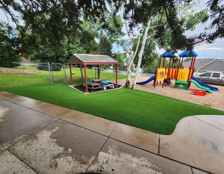 playground turf in a school with playground equipment