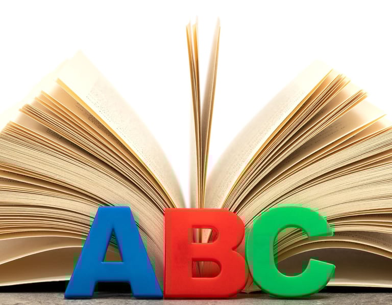 Open book with alphabet letters.
