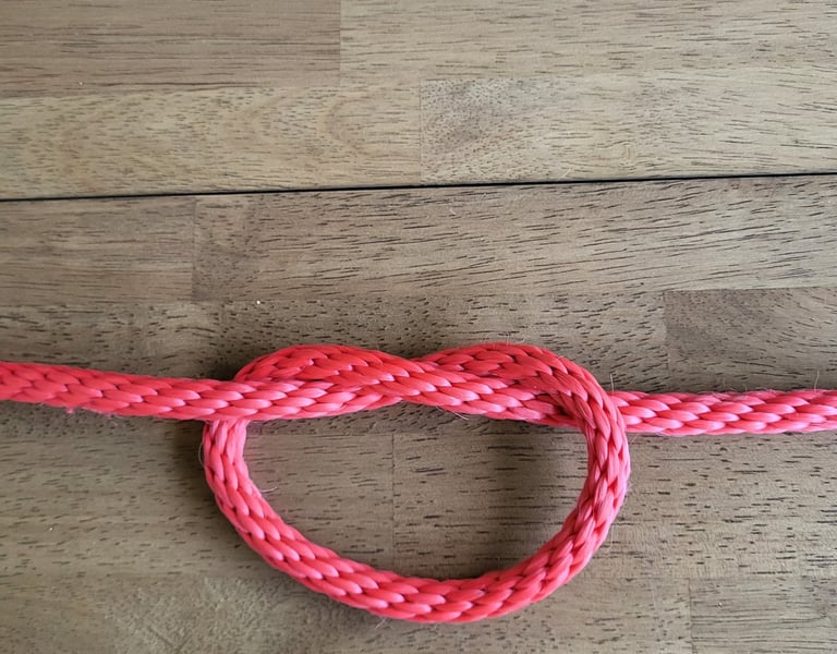 Overhand Knot tied in red rope