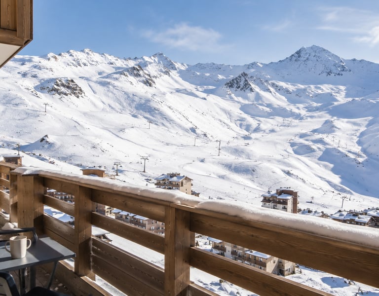 Snowy alpine balcony view in Val Thorens, French Alps, representing winter stay availability.