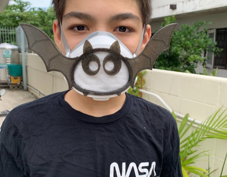 flo-2: boy with Flomask ,Batwings with eyes decoration