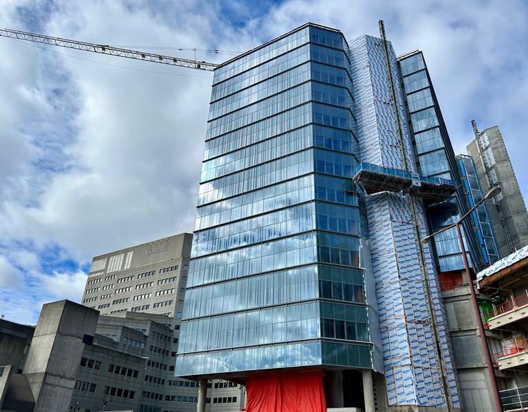 a building with a crane in the background
