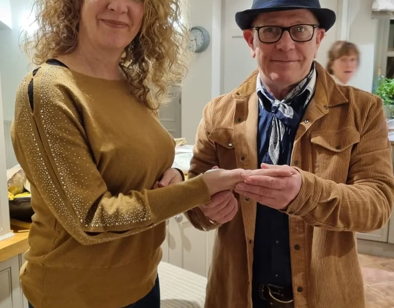 Rob hamilton reading the palm of one of his clients