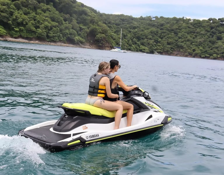 Jet ski adventure on the open ocean during luxury catamaran tour in Papagayo, Costa Rica